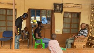 Sallu Kamuskay interviewing paramount chief in Pujehun District 